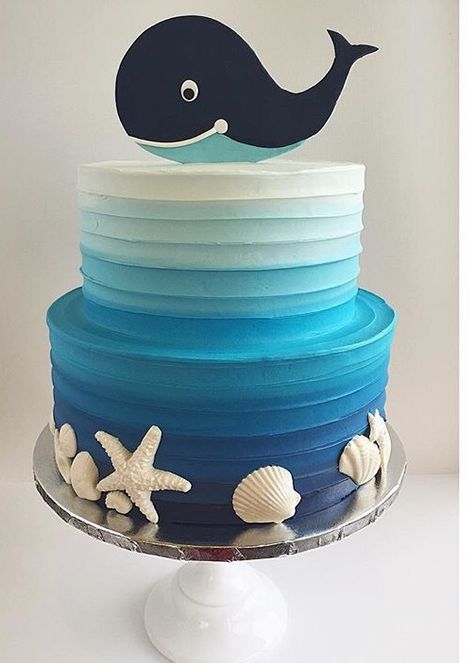 Adorable ocean themed cake with a cut-out whale on top, white chocolate sea shells and blue gradient, textured buttercream icing. Whale Cakes, Textured Buttercream, Whale Birthday, Ocean Cakes, Nautical Cake, Sea Cakes, Fondant Baby, Beach Cakes, Baby Whale