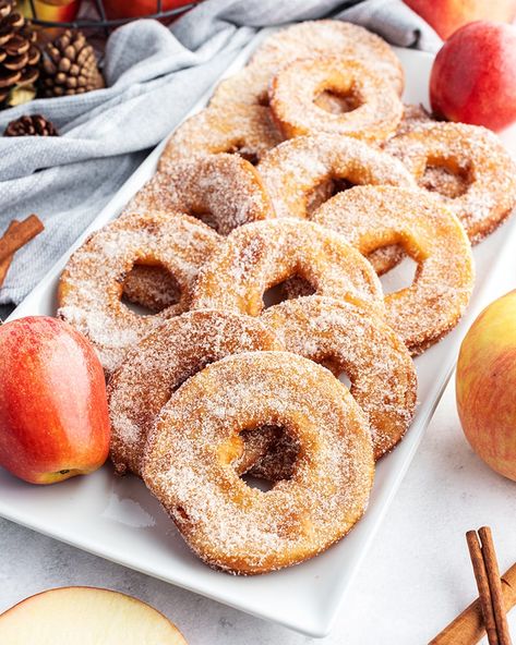 These fried apple rings are the perfect fall treat. They're made with sliced apple rings, dipped in batter and deep fried and covered in cinnamon sugar. They are the perfect flavors of fall in one bite. Deep Fried Apples, Fried Apple Rings, Cinnamon Apple Rings, Fried Desserts, Commercial Deep Fryer, Apple Doughnut, Cinnamon Sugar Apples, Sliced Apple, Fried Apple