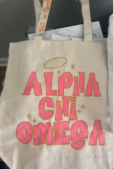 #axo #alpha #chi #omega #sorority #panhellenic #college #painting #totebag Axo Painting, Sorority Tote Bags Painted, Alpha Chi Omega Painting, Chi Omega Symphony, Alpha Chi Omega Canvas, Chi Omega Canvas, Decorated Tote Bags, Alpha Omega Epsilon, Big Little Canvas