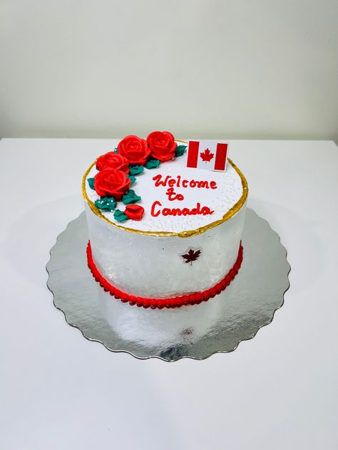 Small Round Welcome cake with Canada flag and maple leaf decorated nicely with red flowers and edible gold paint. Welcome To Canada Cake, Canada Flag Cake, Edible Gold Paint, Welcome Cake, Canada Cake, Welcome To Canada, Flag Cake, Edible Gold, American Dream