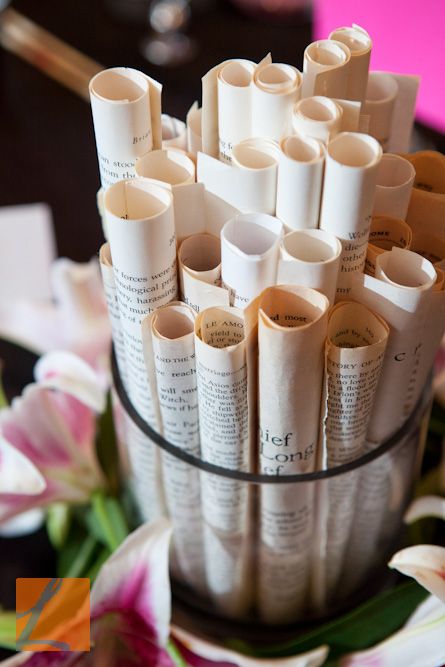 Rolled book pages for table centerpieces. Adding some different height flowers in between might be nice. Tablescape With Books, Women's Conference Decorations, Centerpieces With Books, Book Centerpiece Ideas, Centerpieces Books, Book Party Decor, Book Brunch, Book Page Decor, Book Invitations