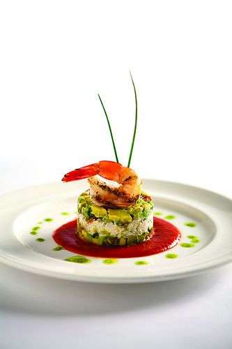 Our chilled Gulf shrimp with jumbo lump crab layered with fresh diced avocado and local tomato, and finished with a spicy tomato coulis, is one of our delicious signature appetizers served at Criollo Restaurant & Lounge. Gastronomic Food, Fine Dining Plating, Food Plating Techniques, Gourmet Food Plating, Shrimp Appetizers, Constant Contact, Fine Dining Recipes, Food Garnishes, Blue Crab