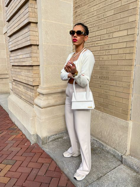 All white classy outifits always make me feel like im in my soft life aesthetic. Its giving black girl luxury! Ive styles a white sweater crop set with cream oversized trousers, new balance 530s, le grande Chiquito jacquemus bag and off white tortoiseshell sunglasses. Oh and you can’t forget the red lip! White Jacquemus Bag Outfit, White Jacquemus Bag, Jacquemus Bag Outfit, Soft Life Aesthetic, Le Grand Chiquito, Oversized Trousers, Tortoiseshell Sunglasses, Jacquemus Bag, Soft Life