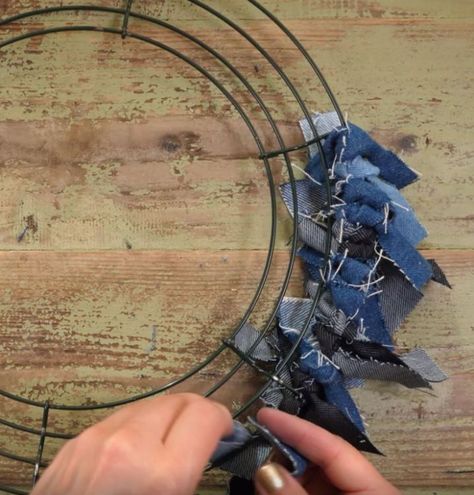 Turn old jeans into pretty front door decor Denim Wreaths, Deco Mesh Wreaths Diy, Denim Crafts Diy, Easy Diy Wreaths, Mesh Wreath Diy, Blue Jeans Crafts, Denim And Diamonds, Door Wreaths Diy, Fabric Wreath