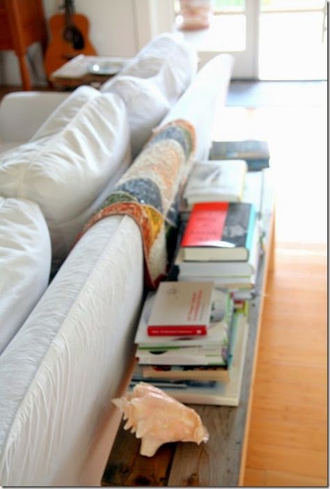 Rustic Bench Behind Sofa, Runner Behind Couch, Wood Bench Behind Sofa, Low Bookshelf Behind Couch, Back Of Couch Entryway, Bench With Books, Long Bench Behind Couch, Low Bench Behind Sofa, Exposed Back Of Couch Ideas