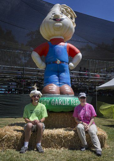 Steven and Erin Berkey, of Laurel, Maryland, pose for a souvenir photo during the 38th annual Gilroy Garlic Festival on July 29, 2016. (Patrick Tehan/Staff) Garlic Festival, Festivals Around The World, Bowling Alley, Our Town, Pinterest Projects, San Diego County, Street Dance, Life Is An Adventure, America Travel