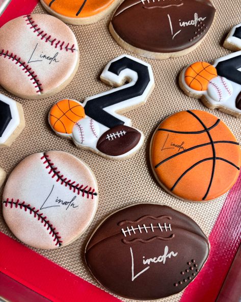 Born Two Ball themed. Love the look of the signature on the balls ☺️ Born 2 Ball Cookies, 2nd Birthday Ball Theme, Sports Themed Cookies, Born 2 Ball Birthday Cake, Born Two Ball Birthday Theme, Born To Ball Birthday Theme, Born Two Ball Birthday, Born 2 Ball Birthday Party, Born 2 Ball Birthday