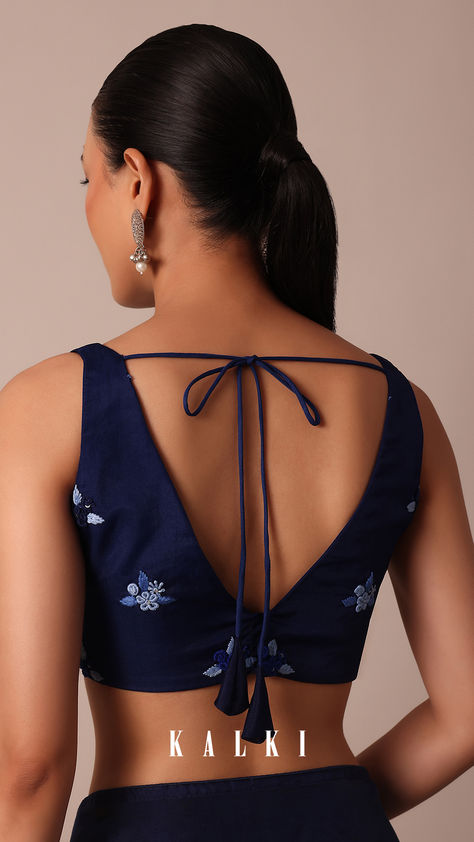 Embrace the allure of festivities in our exquisite Navy Blue Organza Saree. It is adorned with 3D flower bud embroidered floral buttis all over and a resplendent pallu. This ethereal ensemble promises a graceful and enchanting presence. The pack includes one saree and an unstitched blouse fabric for personalised styling. Navy Blue Blouse Designs For Saree, Navy Blue Blouse Designs, Bud Embroidery, Blue Organza Saree, Blouse Designs For Saree, Blue Blouse Designs, Blue Organza, Navy Blue Blouse, Stylish Blouse Design