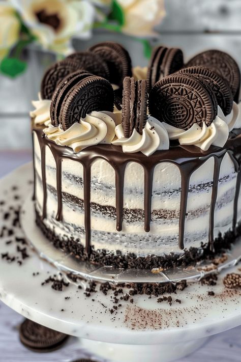 The Ultimate Oreo Cookies and Cream Cake Recipe Guide Ice Cream Cake Cookies And Cream, Oreo Ball Birthday Cake, Cookies And Cream Birthday Cake Ideas, Reese's Birthday Cake, Best Oreo Cake Recipe, Oreo Cake Recipe Homemade Easy, Oreo Cake Ideas, Oreo Cake Designs, New Year’s Eve Cake