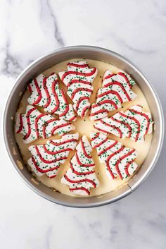 This Little Debbie Christmas Tree Cheesecake is a delightful mashup of creamy vanilla cheesecake stuffed with our favorite holiday snack cakes and topped with white chocolate ganache, the iconic red icing stripes, and green sugar sprinkles! It's a fun and festive treat that is sure to delight everyone this Christmas! | little debbie christmas tree cheesecake recipe | little debbie christmas tree cheesecake incredible recipes | best christmas cheesecake Little Debbie Christmas Tree Cheesecake Recipes, Little Debbie Christmas Tree Cheesecakes, Philadelphia Ready To Eat Cheesecake Filling Recipes, Little Debbie Tree Cheesecake, Little Debbie Dessert Recipes, No Bake Little Debbie Christmas Tree Cheesecake, Little Debbie Christmas Tree Recipes, Little Debbie Christmas Tree Trifle, Cheesecakes For Christmas