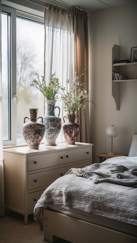 Step into a tranquil bedroom that blends vintage charm with modern IKEA elegance. Discover how vintage vases gracefully adorn a MALM dresser, perfectly complemented by a soft HEMNES bed frame and a chic LACK wall shelf. A delicate SINNERLIG table lamp adds a touch of personality, while gentle morning light filters through sheer curtains, creating a calming atmosphere. This serene space is perfect for anyone looking to elevate their bedroom decor! Explore more ideas and tips for styling your own oasis! #BedroomInspo #VintageDecor #IKEAHacks Lack Wall Shelf, Hemnes Bed, Ikea Style, Malm Dresser, Tranquil Bedroom, Bedroom Oasis, Light Filters, Serene Bedroom, Calming Atmosphere