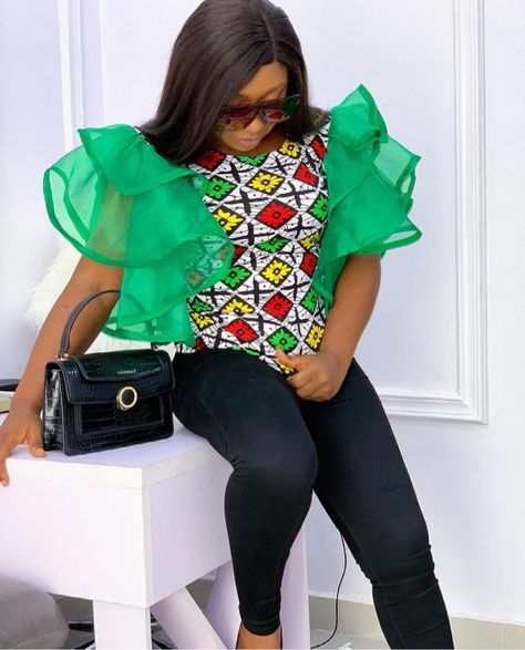 40 Stylish Ankara Blouse Styles For 2022 - The XO Factor Ankara Flare Tops, Ankara Blouse And Skirt, Ankara Blouse Styles, Organza Top Styles, Organza Tops, Ankara Blouses, African Elegance, Ankara Skirts, Ankara Blouse