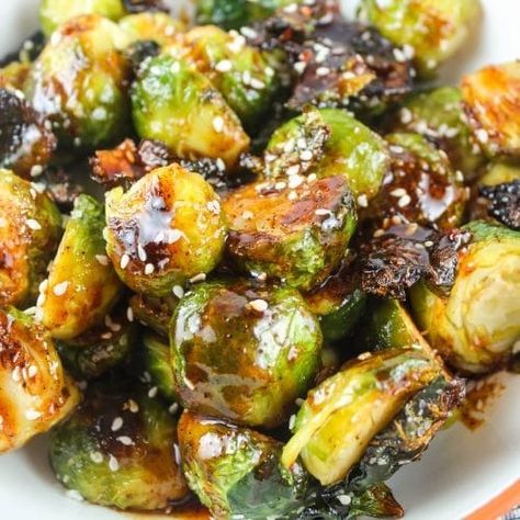 Longhorn Steakhouse has the most amazing Spicy Crispy Brussels Sprouts and I'm going to share with you an amazing copycat recipe that makes them EVEN BETTER at home! These are the best Brussels sprouts! They are so crispy and then they're tossed in sweet & spicy sauce you're going to want to pour on everything! Sweet And Spicy Brussel Sprout Recipes, Copycat Longhorn Brussel Sprouts, Longhorn Steakhouse Brussel Sprouts, Longhorn Brussel Sprouts Recipe, Longhorn Brussel Sprouts, Longhorn Recipes, Longhorn Copycat Recipes, Brussel Sprout Recipe, Longhorn Steakhouse Recipes