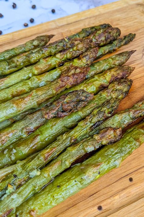 Delicious air fryer asparagus cooked from frozen. No one will notice that you didn't start with fresh asparagus. All you will need are frozen asparagus, melted butter, garlic, salt, and pepper. Enjoy this healthy and easy-to-make vegetable dish. Frozen Asparagus, Air Fryer Pork Chops, Chicken Schnitzel, Clean Eating For Beginners, Frozen Green Beans, Vegetable Dish, Fresh Asparagus, 4 Ingredient, Air Fryer Chicken