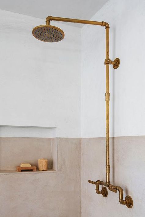 An antique brass exposed plumbing shower kit is mounted on color block two tone shower walls with a two tone shower niche. Exposed Plumbing Bathroom, Contemporary Kids Room, Boy Nursery Design, Exposed Plumbing, Polka Dot Curtains, Green Painted Walls, Contemporary Nursery, Vintage Crib, Shower Plumbing