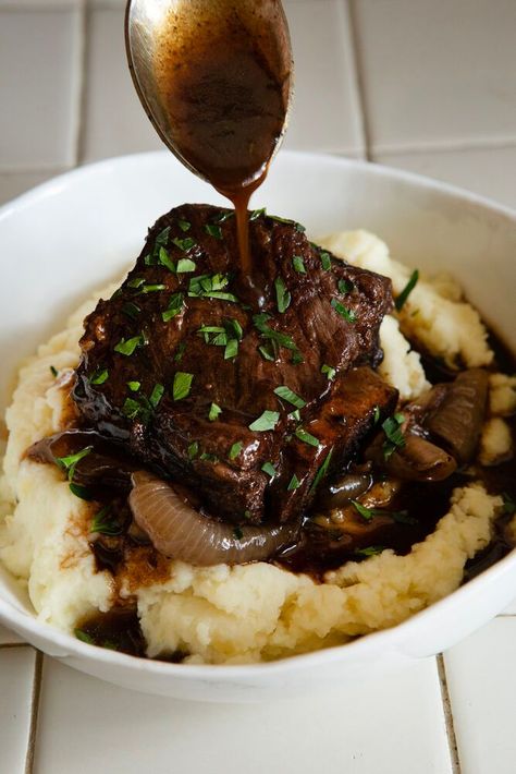 This cozy braised Short Ribs dinner is perfect for celebrating a holiday or special occasion. Long, slow braises are great for wintertime, and these balsamic braised short ribs are as delicious as they are approachable. Braise them in a Dutch oven for about 4 hours in red wine and balsamic vinegar for short ribs that fall off the bone. Then, add an extra drizzle of balsamic vinegar to brighten the flavor of the rich beef. #shortribs #holidaydinnerideas #comfortfood French Onion Short Ribs, Crunchy Asian Salad, Braised Short Ribs Recipe, Beef Entrees, Short Ribs Recipe, Ribs Recipe, Braised Short Ribs, Braised Beef, Beef Short Ribs