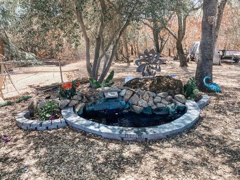 I absolutely love water features, I find the sound of running water calming and soothing. So, I have been working on a couple new water features in my yard, and today I’m sharing one of them. I have this large granite boulder in my back yard that looked a little boring, so I decided what better way to spruce it up then to add a beautiful DIY pond and waterfall, and, since we don’t have electric power in this area, I chose a solar pump with a backup battery to ensure the waterfall was r… Waterfall Tutorial, Solar Pond, Solar Pump, Rock Fountain, Concrete Retaining Walls, Residential Pool, Diy Pond, Solar Water Pump, Pond Waterfall