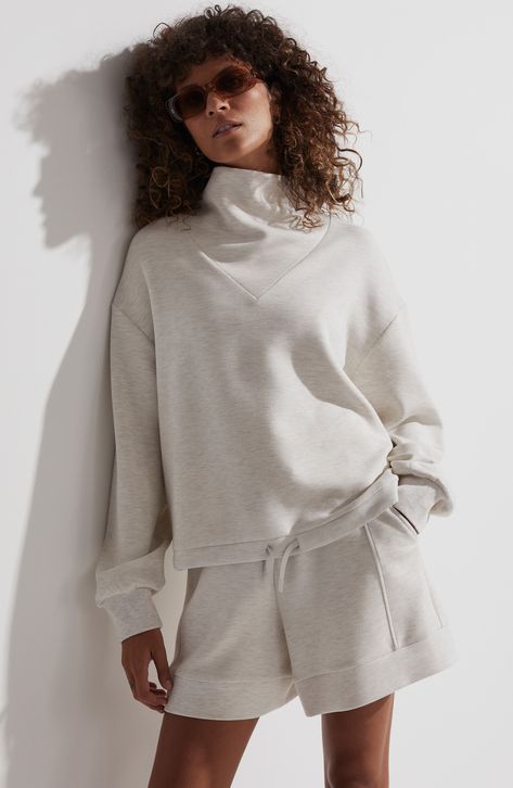 Muted tones and a softly shaped inset funnel neck add style points to this essential sweatshirt designed with a drawstring hem. 23" length (size Medium) Funnel neck Ribbed cuffs 72% viscose, 23% polyester, 5% elastane Machine wash, dry flat Imported Funnel Neck Sweatshirt, Turtleneck Sweatshirt, Sweatshirt Outfit, Funnel Neck, Funnel, Nordstrom, Long Sleeves