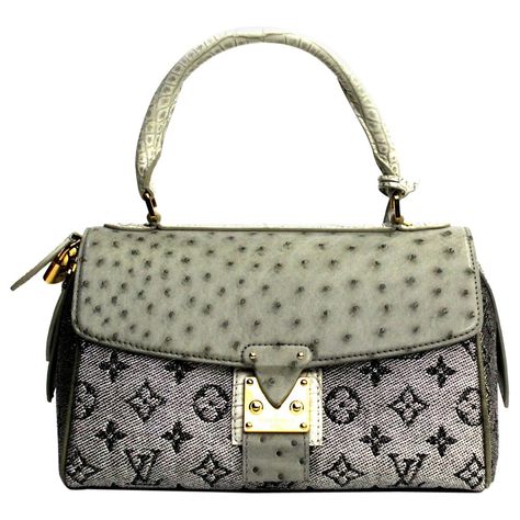 This LOUIS VUITTON Carrousel is in Excellent Pre-Owned Condition accompanied by Louis Vuitton Dust Bag, Lock, Keys, Clochette, Care Booklet, Tag, Bag Shaper. Circa 2010. Primarily made from Alligator Leather, Ostrich Leather, Jacquard Fabric complimented by Golden Brass hardware. Rare Designer Bags, Louis Vuitton Vintage Bag, Celebrity Bags, Louis Vuitton Dust Bag, Purse Collection, Bag Lock, Best Designer Bags, Limited Edition Bag, Louis Vuitton Limited Edition