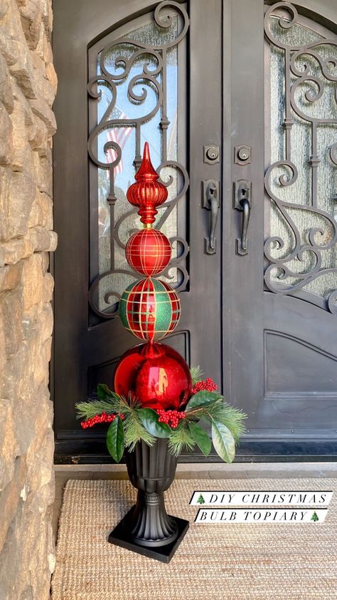 diyfrenchfarmhouse on Instagram: ❤️💚So many things are flying off of the shelves this year...I wanted to share this DIY Christmas Bulb Topiary with you all while the… How To Make Christmas Topiary, Christmas Ball Topiary Ornament Tree, Christmas Ball Topiary Diy, Christmas Finials Diy, Topiary Christmas Tree, Christmas Topiary Outdoor Diy, Diy Topiary Ball, Diy Christmas Topiary Front Doors, Christmas Ornament Topiary Diy