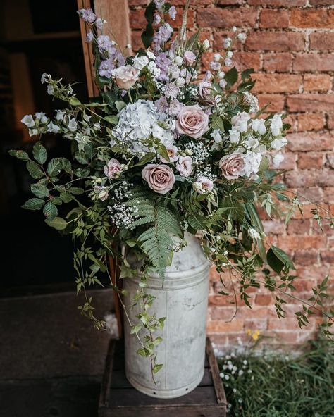 Flowers In Buckets Wedding, Flowers In Milk Can, Milk Churn Wedding Flowers, Allium Bouquet Wedding, Aisle Flowers Wedding, Wedding Flowers On Whiskey Barrels, Bluebells Flower Bouquet, Wiskey Barrell Ideas Flowers Wedding, Ceremony Flowers Aisle