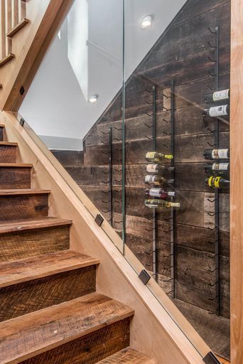 Under Staircase Wine Cellar | Living Stone Design + Build #customhome #mountainhome #wncmountains #ashevillenc #northcarolina #green #builder #design #interiordesign #customhomebuilder #livingstone #greenbuilding #toxinfree #indoorair #indoorairquality #sustainable #clean #LSDB #cleanair #mountainliving #happier #healthier #pure #quality #mountainmodern #modern Staircase Wine Cellar, Under Staircase, Stair Ideas, Cashiers Nc, Wine Closet, Wine Wall, Mountain Living, Mountain Modern, Basement Renovations