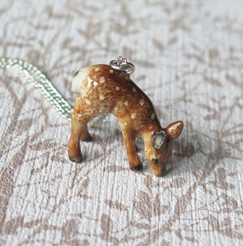 This stunning baby deer pendant is made from porcelain and is hand painted, then coated in a ceramic glaze.  Each pendant comes with a sterling silver plated chain which measures approximately 60.96cm/24" and comes beautifully presented in a gift box.   The pendant itself measures approximately 2.6cm/1.02inches in width x 2.3cm/0.91inches in height. PLEASE NOTE: Each pendant is made from porcelain which is delicate and should be handled with care. It is not advisable for them to be worn when sle Deer Jewelry, Deer Necklace, Spiritual Animal, Porcelain Animal, Animal Pendant, Ceramic Glaze, Baby Deer, The Hope, Silver Plated Jewelry