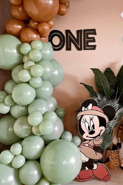 Check out this fun Mickey Mouse safari birthday party! The balloon garland is fab! See more party ideas and share yours at CatchMyParty.com Mini Mouse 1st Birthday, Mickey Safari Birthday, Safari 1st Birthday Party, Safari Birthday Party Ideas, Safari 1st Birthday, Safari Party Decorations, Minnie Mouse Birthday Theme, Mickey Birthday Party, Mickey Safari