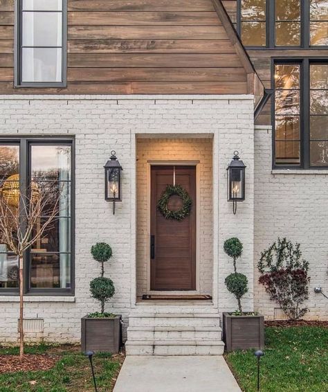 stunning material combination of wood and painted white brick, looks like just part of a modern home addition with lots of black framed windows White Brick House, Casa Exterior, Exterior Remodel, Front Door Design, Windows Exterior, White Brick, Painted Brick, Exterior Wood, Exterior Paint Colors