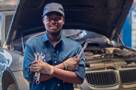 Photo african man mechanic in uniform wi... | Premium Photo #Freepik #photo #car-workshop #car-garage #car-service #car-maintenance Mechanic Quotes, Mechanics Uniform, Mechanics Quotes, Motor Mechanics, Crossed Arms, Mechanic Life, Mechanical Workshop, Amazing Inspirational Quotes, Famous Movie Quotes