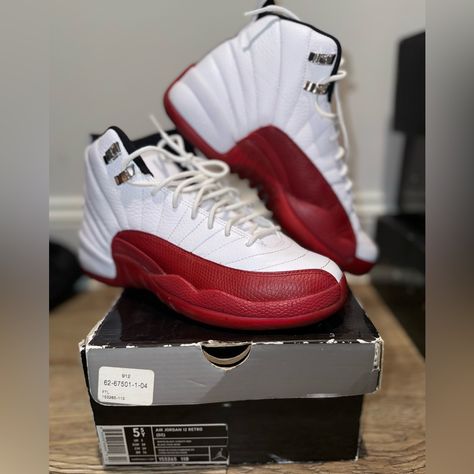 The Air Jordan 12 Retro Gs "Cherry" Was Released On December 10, 2022. **Description:** This Iteration Features A White Leather Upper With Vibrant Red Accents, Including The Iconic Jumpman Logo And The "23" On The Heel. The Design Is Characterized By Its Sleek Silhouette And A Textured Overlay That Adds Depth. The Rubber Outsole Provides Traction And Durability, Making It Both A Stylish And Functional Sneaker. The "Cherry" Colorway Pays Homage To The Classic Aesthetic Of The Jordan Brand While A Jordan 11s, Jordan Retro 12, New Jordans Shoes, Air Jordan 12, Jumpman Logo, Classic Aesthetic, Air Jordan 12 Retro, Jordan 12 Retro, Jordan 12