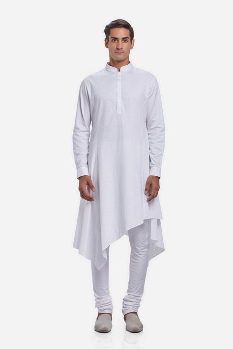 The New Age Indian Menswear; this classic kurta is rendered in cotton. Punctuated with an asymmetric draped hemline, the overall fit streamlines the form. Finish with a classic white churidar and velvet loafers #GauravGupta #GauravGuptaMan #GGMan #MensFashion #Menswear #Kurta #Draped Angarkha Kurti Pattern, Angarkha Kurti, Menswear Kurta, Kurta Ideas, Indian Menswear, Mens Pattern, White Churidar, White Wing, Indian Groom Wear