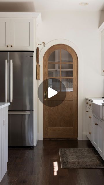 Erin Gerlach | Hamilton Park Home on Instagram: "Arched pocket door reveal ✨ Get the arched pocket door look with a regular square door (and at a fraction of the cost)! I replaced our existing pocket door with this beautiful wooden door from @simpsondoorco. And once it’s placed in an arched opening, bam… arched door look achieved!!!" Rustic Pocket Doors Ideas, Laundry Room Arch Door, Round Pocket Door, Kitchen With Pocket Doors, Pocket Door To Pantry, Wooden Pocket Doors, Diy Arched Door, Arch Pantry Door, Arch Pocket Door