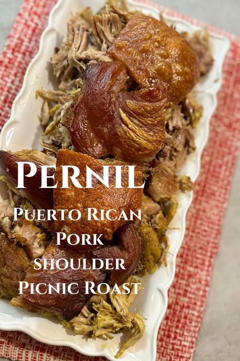 Beyond being an iconic Christmas dish, pernil (bone-in pork shoulder picnic roast) is also a popular item at parties, events, and weddings or forms part of the regular Puerto Rican household menu. In addition to its fall-off-the-bone, juicy, tender meat, pernil has a unique characteristic: The Cuerito. The pork skin, or cuerito's toasty top, which we test with a knife or cleaver, has a crisp exterior with a crunch that is music to the ears! Spanish Pork Shoulder, Pork Shoulder Picnic Roast, Puerto Rican Pernil, Pork Shoulder Picnic, Pork Picnic, Picnic Roast, Pork Skin, Pork Shoulder Recipes, Iconic Christmas