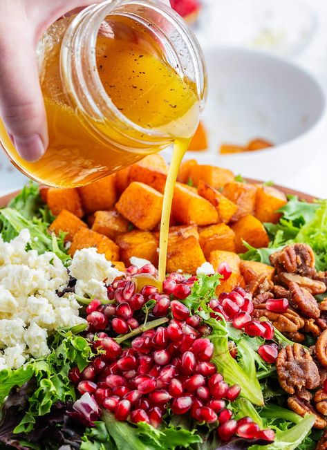 Apple Cider Vinaigrette being poured onto a fall salad with butternut squash. Fall Harvest Roasted Butternut Squash And Pomegranate Salad, Warm Butternut Squash Salad, Fall Salad With Butternut Squash, Butternut Squash Fall Salad, Fall Harvest Salad Butternut Squash, Acorn Squash Salad, Apple Vinaigrette, Salad With Butternut Squash, Carnival Squash