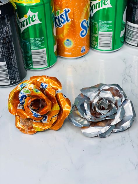 Soda Can Flowers How To Make, Soda Can Upcycle Ideas, Monster Can Flower, Soda Can Flowers Diy, Soda Can Ideas, Recycled Cans Projects, Flowers Made From Recycled Materials, Crushed Can Art, Can Flowers Diy Tin