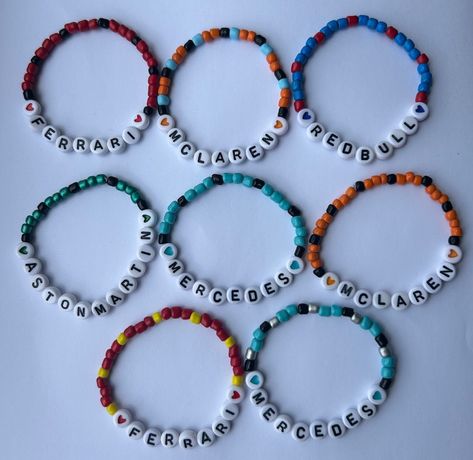 F1 Team name bracelets. White letter beads with team coloured hearts and beads. F1 Beaded Bracelets, Bead Bracelets Words Ideas, F1 Friendship Bracelet, F1 Bracelet Ideas, Bead Name Bracelets, F1 Bracelet, Bracelets Bff, Fan Bracelet, Team Bracelets