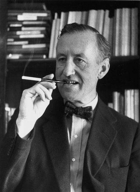 Ian Fleming, British author and creator of James Bond, smoking with a cigarette holder. James Bond Books, Jamesbond 007, Lara Pulver, Bond Series, Spy Novels, James Bond Movies, Ian Fleming, Bond Films, Bond Movies