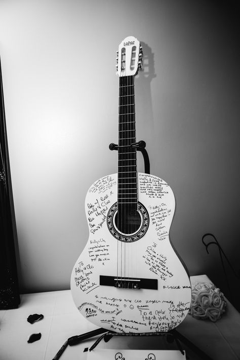 I really didn't want a wedding guest book so we opted for a guest guitar instead #guestguitar #acousticguitar #guestbook #ulternativewedding #lesbianwedding Guitar Wedding, Lesbian Wedding, Wedding Songs, Wedding Aisle, Wedding Guest Book, Acoustic Guitar, Guest Book, Wedding Guest, A Wedding