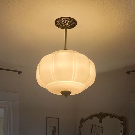 This vintage style recessed shade features a milk glass shade and an oiled brass frame, which creates a cozy atmosphere with the warm glow of soft light emanating through the milk glass shade. The brass frame is oiled to reveal a classic and elegant metal texture that is durable and easy to match with a variety of decor styles. The overall vintage style of the chandelier makes it suitable for use in living rooms, dining rooms, bedrooms and other spaces, adding a unique flavor to your home. Designed to illuminate your bedroom, living room, entryway, dining room, or even a cozy corner in your restaurant or coffee shop, this pendant light is a testament to the art of timeless design. Crafted with a golden metal base that exudes a warm glow, it pairs beautifully with the milk glass pendant lig Milk Glass Pendant, Milk Glass Pendant Light, Retro Pendant Lights, Pendant Lighting Bedroom, White Pendant Light, Dimmable Lamp, Metal Texture, Cozy Atmosphere, Glass Pendant Light