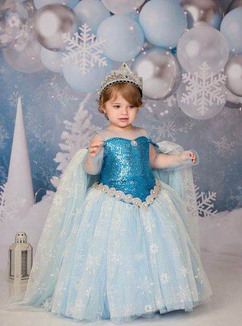 This beautiful slightly below the knee dress is made with extremely soft glittery tulle and lined from top to bottom with cotton perfect for baby and children sensitive skin. Each dress comes with a matching headband and a cape. Pre-Order: Ships in 3-4 weeks. Need Something Different Or Different Color? WhatsApp: 16314885153 Call: 1(888) 381-3742 This dress can be custom made up to age 12 years. ... daha fazla Elsa Birthday Dress, Event Clothes, Below The Knee Dress, Frocks For Kids, Princess Birthday Party Decorations, Frozen Birthday Theme, Frozen Dress, Angel Kids, Snow Theme