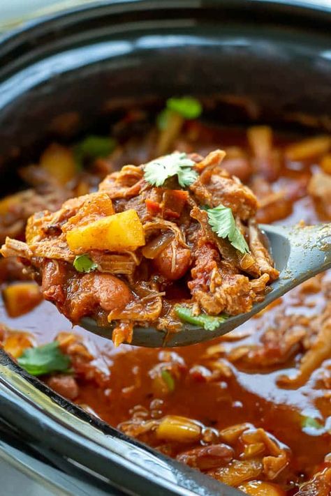 a large serving spoon lifting pork chili out of a slow cooker Pork Loin Chili, Pork Shoulder Chili, Pulled Pork Chilli, Pork Chili Verde Recipe, Pulled Pork Chili Recipe, Chili Recipe Slow Cooker, Pork Chili Recipe, Pulled Pork Chili, Slow Cooker Chili Easy