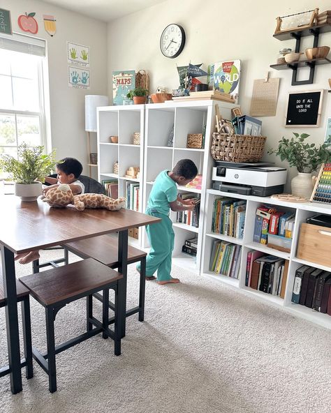 Schoolroom surprise! After our first week back to school, I quickly decided some changes needed to be made to our school room. I found myself going up & down the stairs a lot, not putting things back in the proper place, and feeling overwhelmed. I love doing homeschooling in our actual schoolroom, that's why we have it. Over the years we have schooled pretty much everywhere, especially when my littles were babies.… I wanted to school only in the living room or dining room. Now that everyon... School Area At Home, Tiny Homeschool Space, Living Room Homeschool Space, Homeschool Dining Room Ideas, Playroom Dining Room Combo, Homeschool Living Room, Dining Room Homeschool Space, School Room Homeschool, Dining Room To Playroom