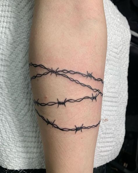 Barb Wire Wrap Around Tattoo, Barbed Wire Tattoo Around Wrist, Barbwire With Flowers Tattoo, Forearm Barbed Wire Tattoo, Barbwire Forearm Tattoo, Barbwire Tattoo Around Leg, Barb Wire Tattoo Around Arm Men, Barbed Wire Bicep Tattoo, Women Barbwire Tattoo