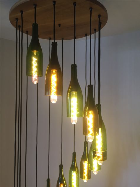 Glass Bottle Lights, Wine Bottle Lights, Glass Bottle Chandelier, Bottle Ceiling Lights, Bottle Light Fixture, Bottle Hanging Lamp, Glass Bottle Diy Projects, Bottle Pendant Light, Cool Light Fixtures