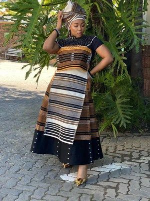 24 Xhosa Traditional Attire for Women 2024 - Best in South Africa Modern Xhosa Attire, Shweshwe Dresses For Makoti, Xhosa Traditional Attire, Xhosa Attire, Shweshwe Dresses, Fashion Stand, Traditional Attire, Modern Outfits, Modern Fashion