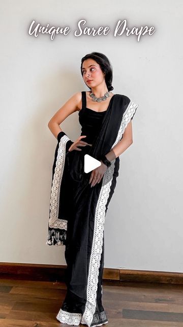 𝐀𝐫𝐜𝐡𝐞𝐞 | Saree Drapes on Instagram: "Save and send this unique saree draping tutorial to a saree lover 🖤  Saree of the day- draped a stunning pure mul cotton in deep black contoured with white lace and cute tassels.  Paired it with a black cropped top, braided my hair and added junk jewellery. (choker, and nosepin)  Cottons are so pretty but can’t always style them plain so I decided to do a chic drape and now I can’t unsee this wholesome beauty.  How to wear a saree as a beginner- 🖤 Pick lightweight pure silk sarees fabric like katan silk, tussar silk, mysore silk, mulberry silk, khaddi chiffon, Khaddi Georgette, gajji silk, assam silk and pure cotton. 🖤 Choose a contrasting design blouse. Refer to pinterest for blouse design ideas. 🖤 Start by wearing your heels or any footwear Georgette Saree Draping Styles, Chiffon Saree Draping Styles, Modern Saree Draping Styles, Plain Sarees With Contrast Blouse, Unique Saree Draping, Modern Saree Draping, Saree Draping Tutorial, Drape Skirt Pattern, Blouse Design Ideas