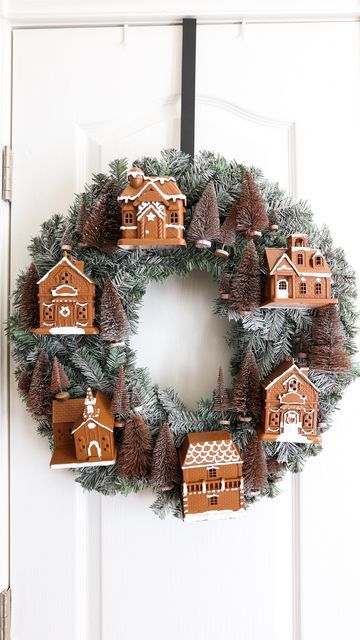 Liz Fenwick DIY on Instagram: "I was inspired by the famous Anthropologie village wreath, but I was NOT loving the $200 price tag!! 😳 So I made my own and added a gingerbread twist! 😍🎄 I got the houses from Dollar Tree and the wreath from Hobby Lobby! What do you think? Do you like the gingerbread trend?? 🤔 #dollartreediy #dollartreefinds #dollartreecrafts #dollartreecommunity #dollartreeobsessed #christmasdecor #christmasdecorating #christmaswreath #wreathdecor #diywreath" Christmas House Wreath, Diy Gingerbread Wreath, Gingerbread Wreath Diy, Dollar Tree Gingerbread House Diy, Gingerbread Wreaths Christmas, Christmas Village Wreath, Mini Wreath Diy, Diy Dollar Tree Wreath, Gingerbread House Wreath