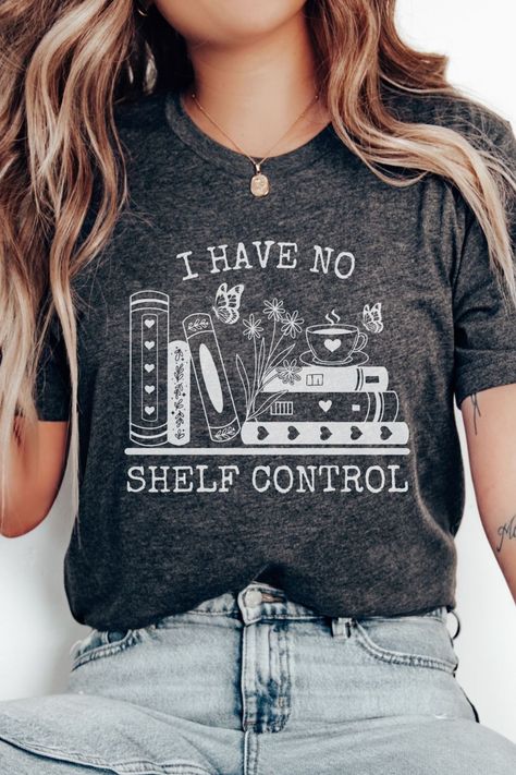 A playful shirt with a graphic of a bookshelf filled with books and butterflies. The shirt humorously reads "I have no shelf control" in a lively font. It's a no shelf control shirt, ideal as a bookworm gift, a librarian reading shirt, or a book lover's gift. The design caters to bookish individuals, including book nerds and members of book clubs. Book Lover Shirt Ideas, Spicy Book Shirt Ideas, Reading T Shirts, Book Themed Shirts, I Have No Shelf Control, Book Shirts Funny, Shirts About Books, Book Shirt Design, Bookish Shirt Ideas