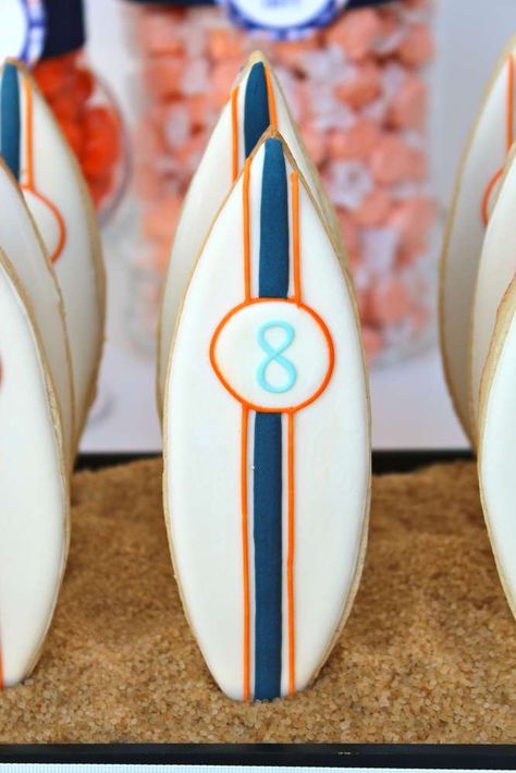 Surfboard cookies at a surf birthday party! See more party planning ideas at CatchMyParty.com! Coastal Cookies, Surfboard Cookies, Surfer Party, Surf Cake, Surf Birthday Party, Surf Birthday, Beach Cookies, Surf Party, Summer Party Themes